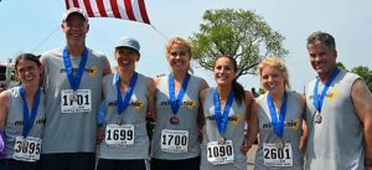 Running Miles for Mia at the Fairfield Half Marathon were Oliva Nestro, John Pfohl, Dawn Pfohl, Alexa Pfohl, Rebeca Buck, Sara Steere and Sean Carroll. — Lisa Romanchick photo