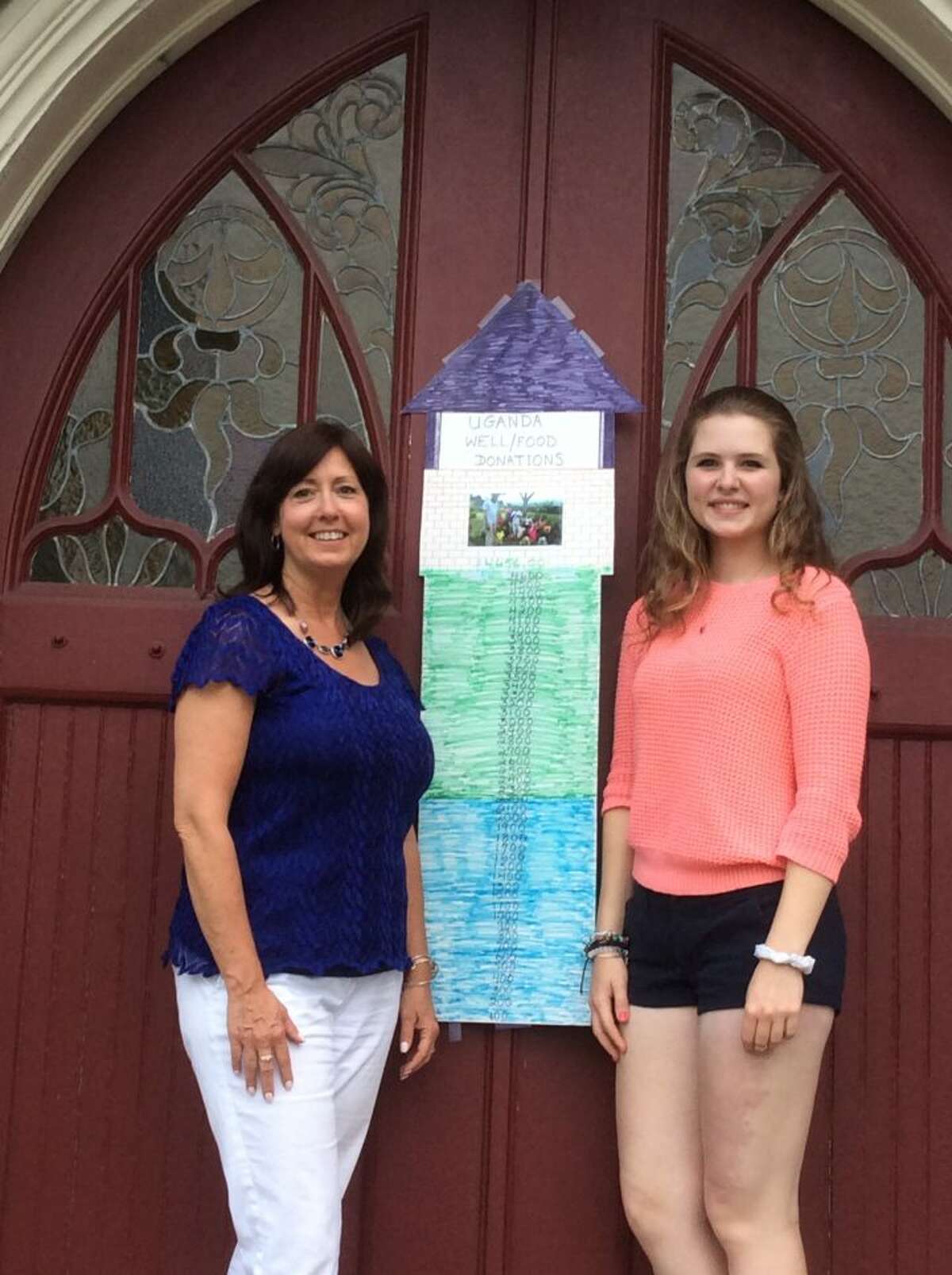 Wendy Ferencz, who spearheaded the drive, and Trumbull High School senior Sarah Thornton stand in front of Trumbull Congregational Church.