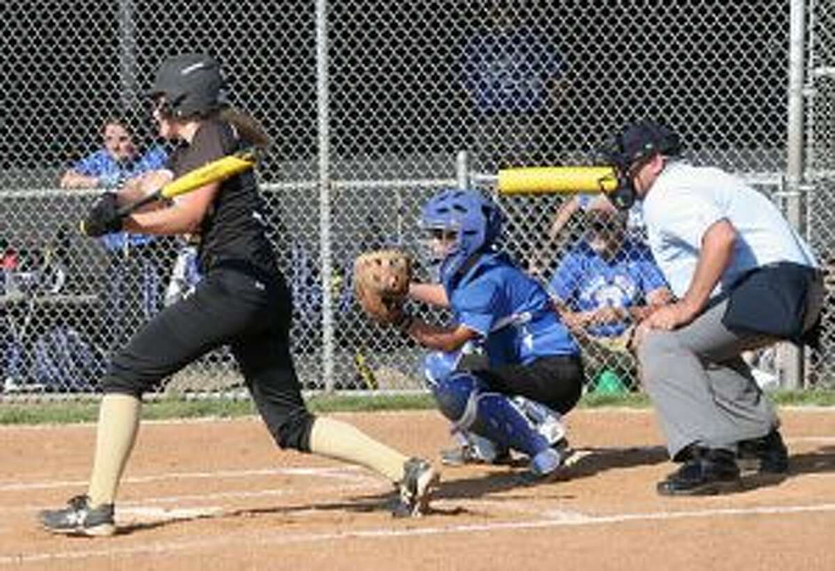 Trumbull High's Ally Szabo singles to right field to give her team a 1-0 lead.