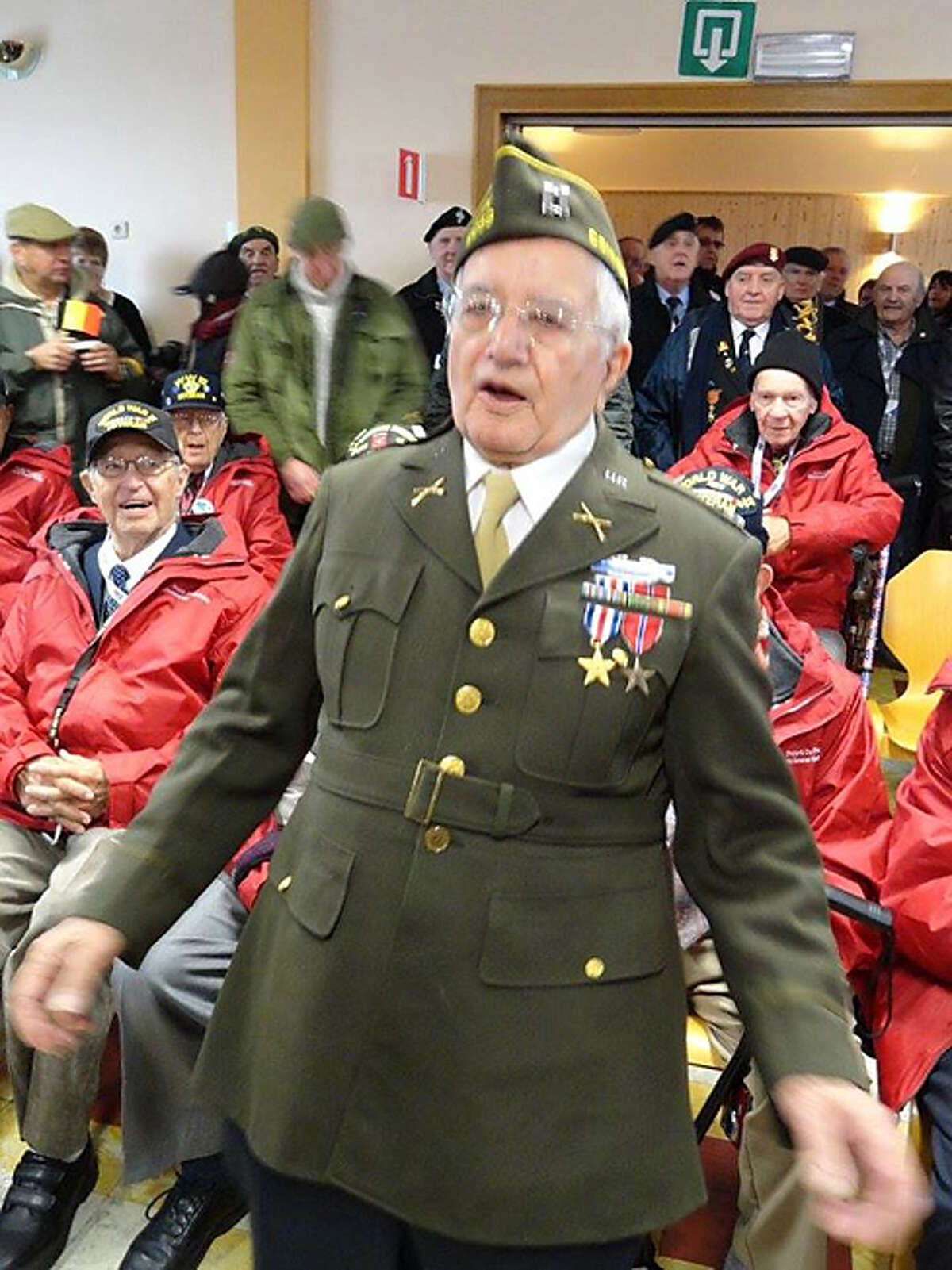 Capt. James Morgia sings a song with fellow veterans during the Battle of the Bulge anniversary events in January 2015.
