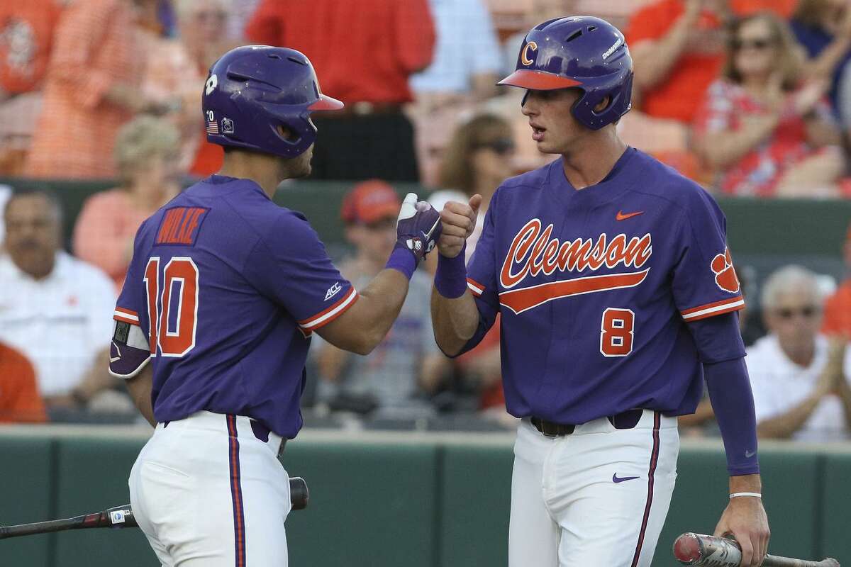 Vanderbilt and Clemson met in game four of the NCAA 2018 Division I Baseball Championship held at Clemson's Doug Kingsmore Stadium on Saturday June 2, 2018. Kyle Wilkie (10) of Clemson congratulates Logan Davidson (8) after scoring a run.