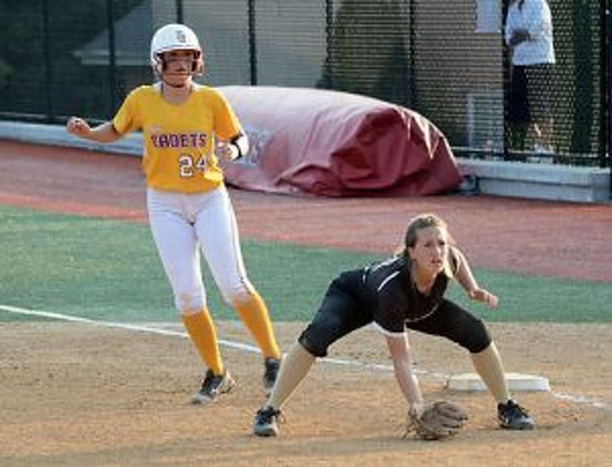 Melissa Bike, who singled in a run, looks to get a jump off first base, as Trumbull's Briana Giacobbe gets in position to make a play. — Andy Hutchison photo