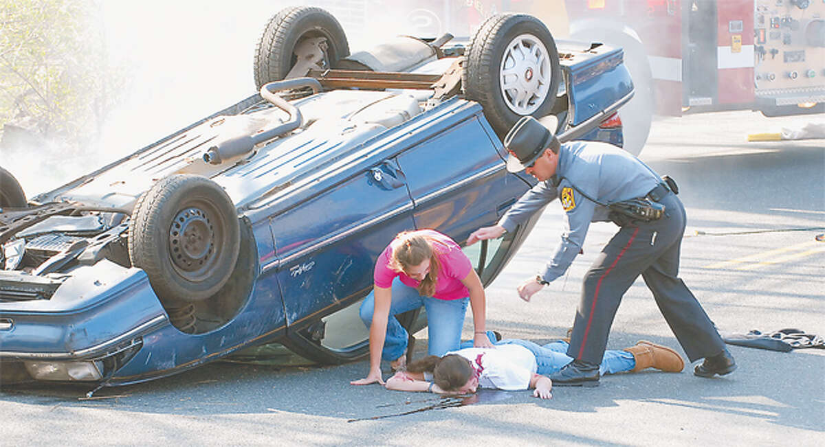 A mock car crash in 2008 held at Ridgefield High School used policemen, firefighters and student actors. —Scott Mullin photo