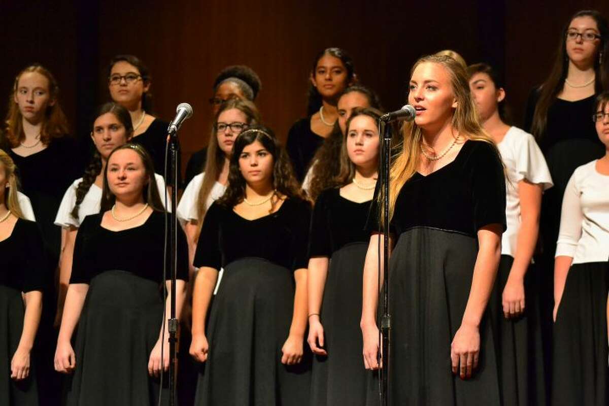 Senior Kelly Cranston leads off the Women's Ensemble group during the winter Holiday Concert 2015. — Lisa Romanchick photo
