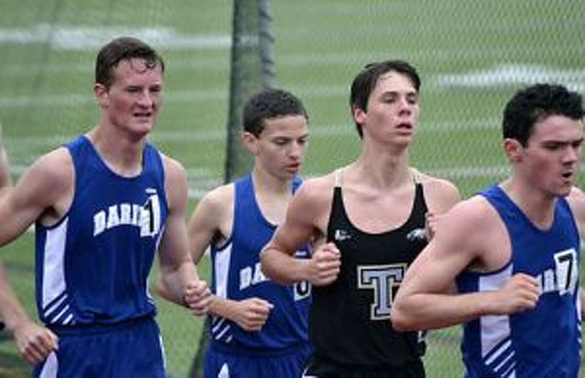 Trumbull High's Charlie Taubl runs with the pack from Darien High at the Golden Eagle 5K. Taubl finished third in the heat, setting a school record in the process.