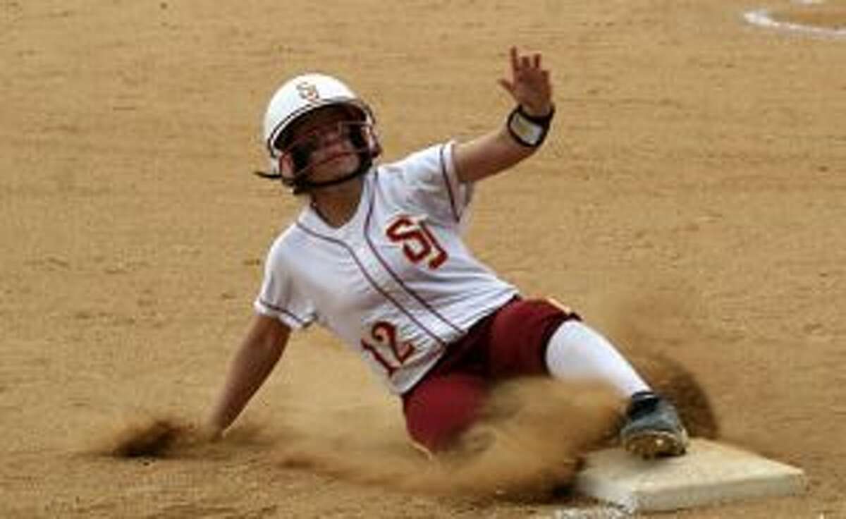 St. Joseph’s Hanna Errico slides into third base in the fifth inning in the win over Staples. — Bill Bloxsom photo