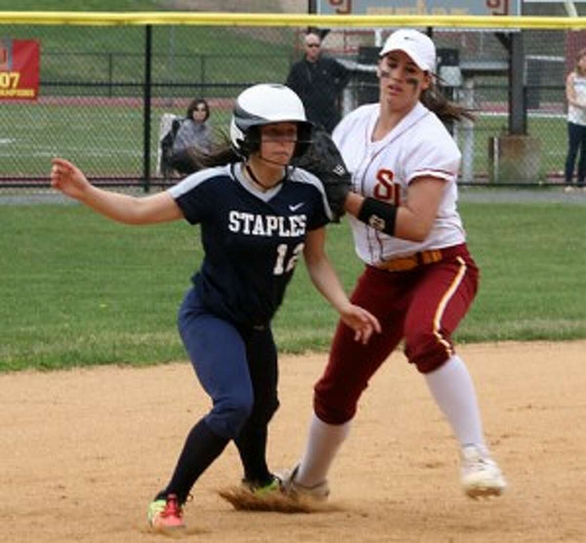 St. Joseph shortstop Kayla Giacobbe makes the tag on Staples' Gabby Perry in the third inning. — Bill Bloxsom photo