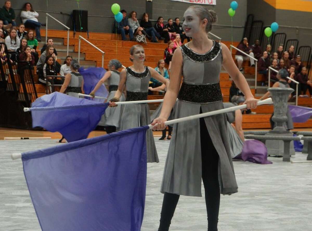 A Color Guard member performs at last year's MAC Championships.