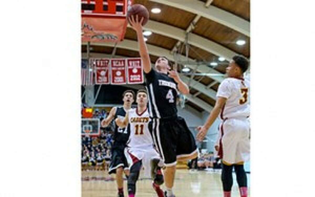 Trumbull's Jack Moore gets inside to score two of his 22 points. — David G. Whitham photo
