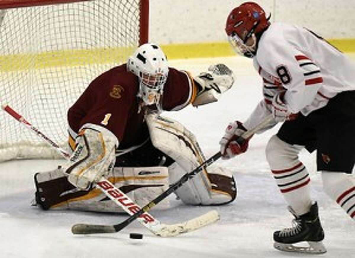 St. Joseph's Ryan Wilson looks to stop Greenwich's Alex Mozian during the FCIAC title game. — Dave Stewart photo