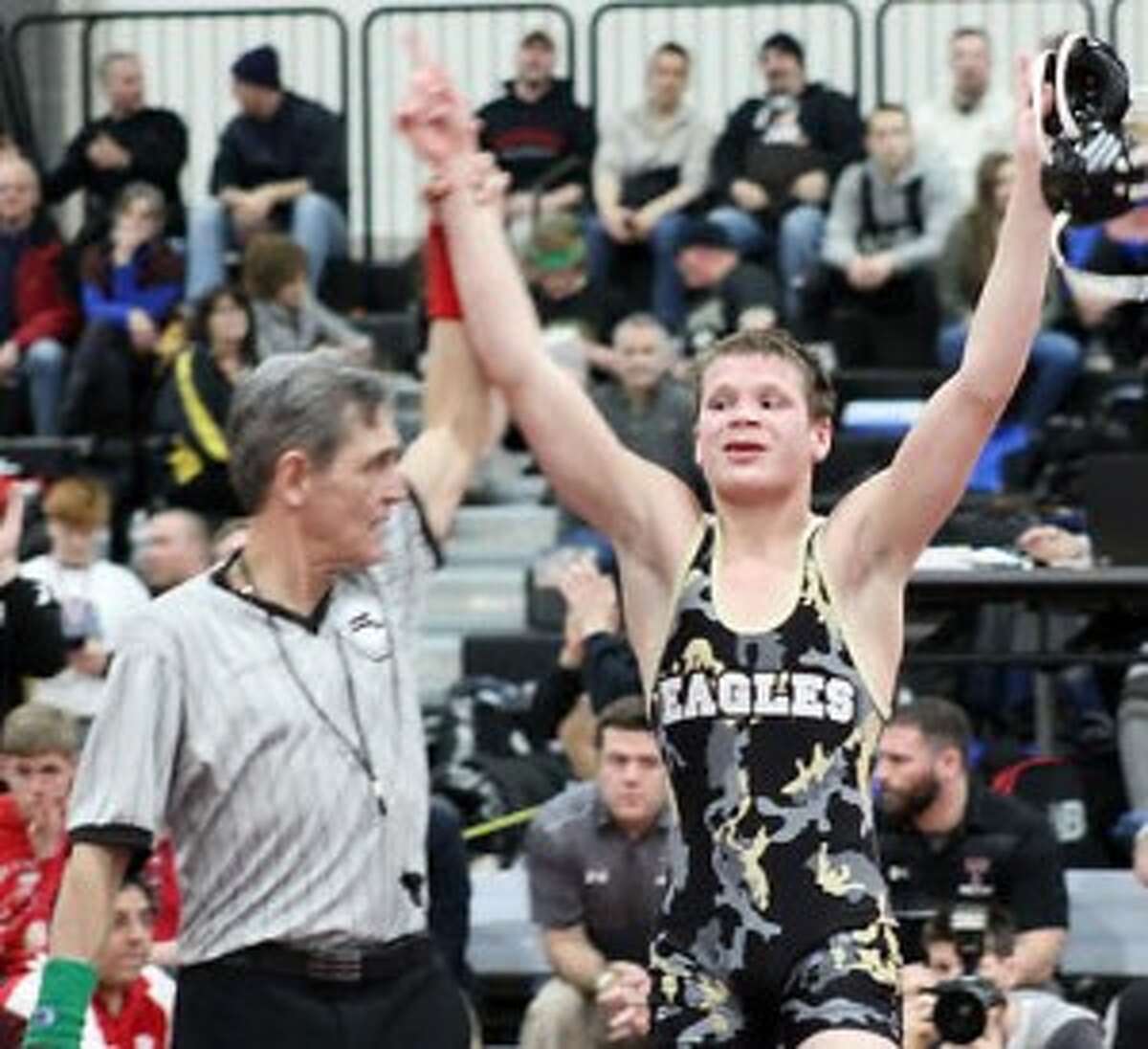 Trumbull's Tristan Haviland has his hands raised after winning the program's first New Enfland title. — Michele Mirmina photo