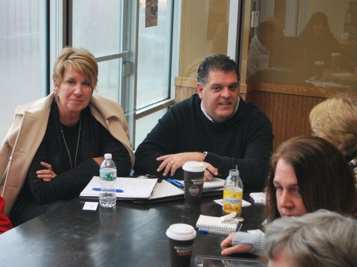 State reps Devlin and Rutigliano at a recent coffee hour in Trumbull where they discussed local and state issues with residents.