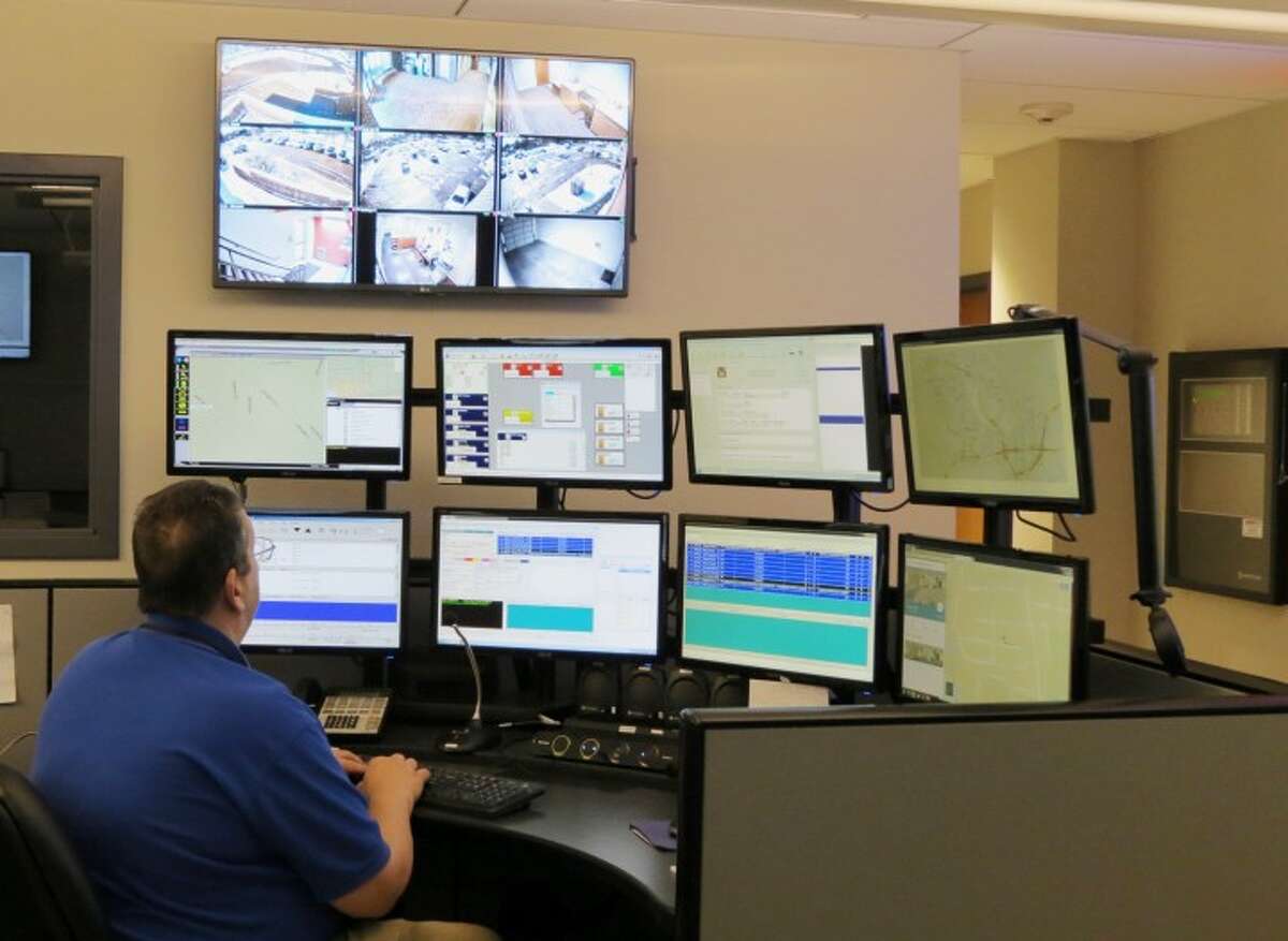 Trumbull Police Dispatcher John Butz works at the new Emergency Communications Center console at police headquarters.