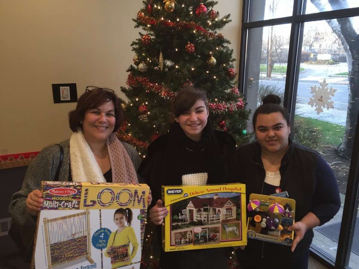Cindy Anelante, Cassandra Anelante and Rosario Terron, lead bilingual advocate at The Center for Family Justice. - John Brannelly photo