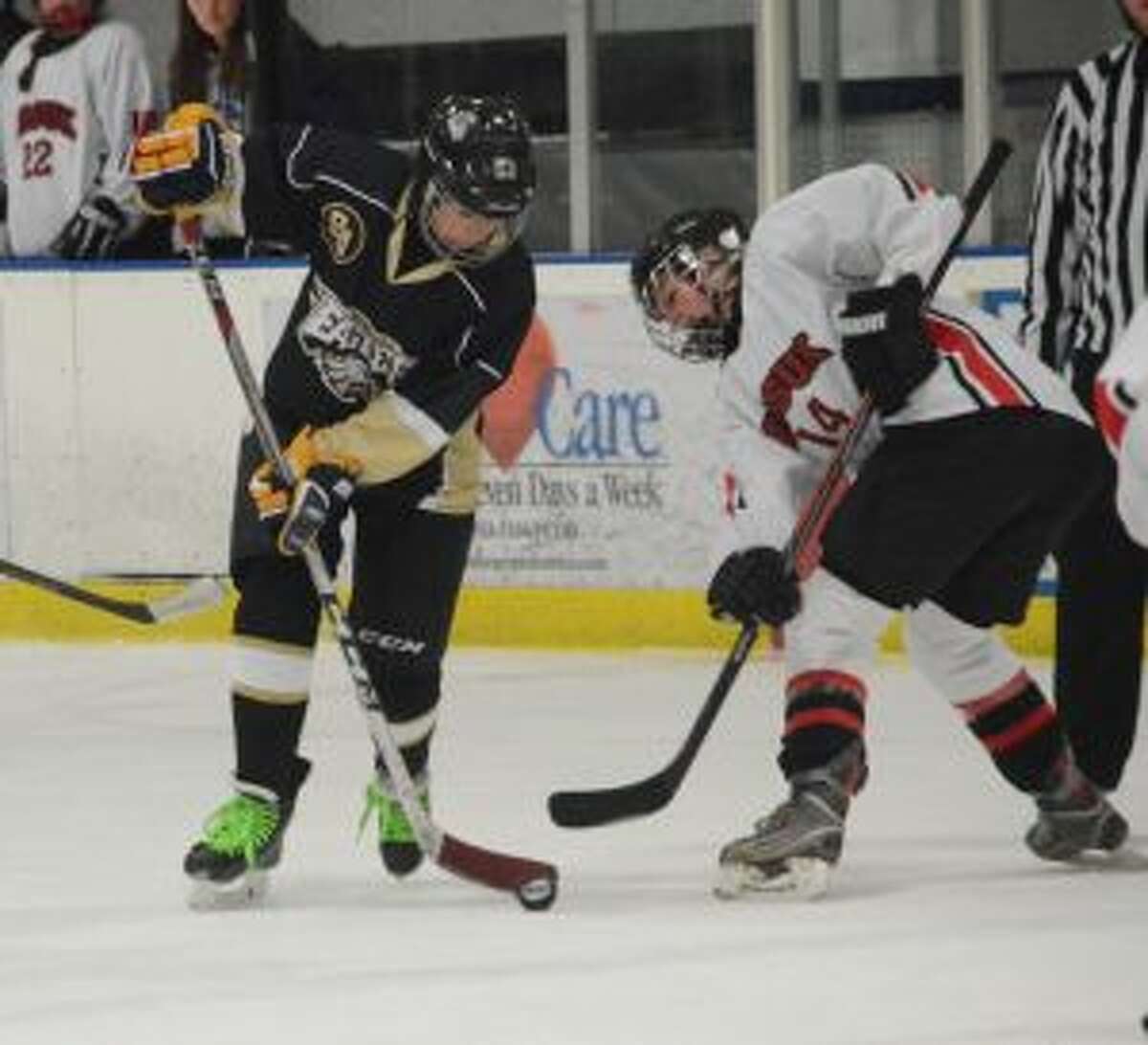 Trumbull-St. Joseph's Marcie Silberger wins a face-off. — Andy Hutchison photo