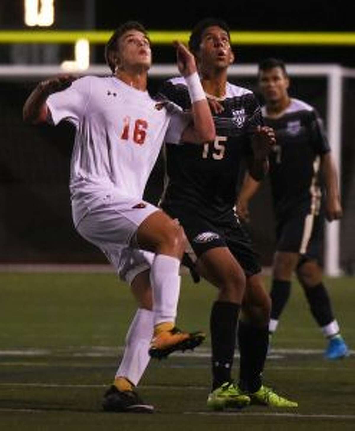 Greenwich's Francisco Ligouri and Trumbull's Matheus Santiago look to make a play in the air. - Dave Stewart photo