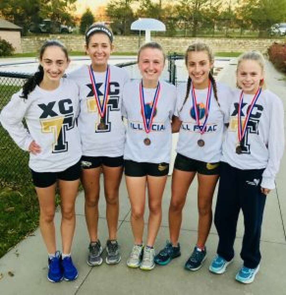 Trumbull’s top five varsity runners, Brenna Asaro, Ashley Storino, Maggie LoSchiavo, Ally Zaffina and Kiki Grant, posted the fastest team combined time in school history at the FCIAC Championship Meet on Oct. 18.