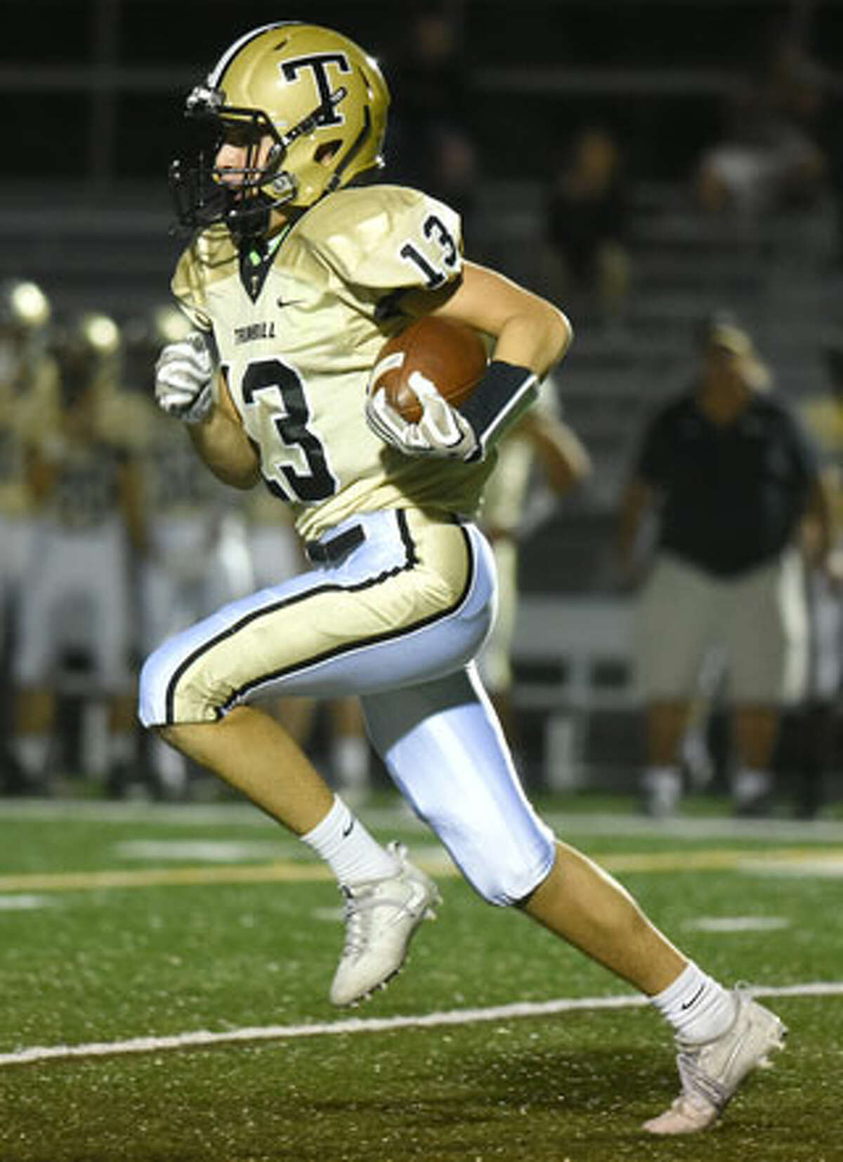 Trumbull's Nolan Shay runs for some yards during Friday's game in New Canaan. — Dave Stewart photo