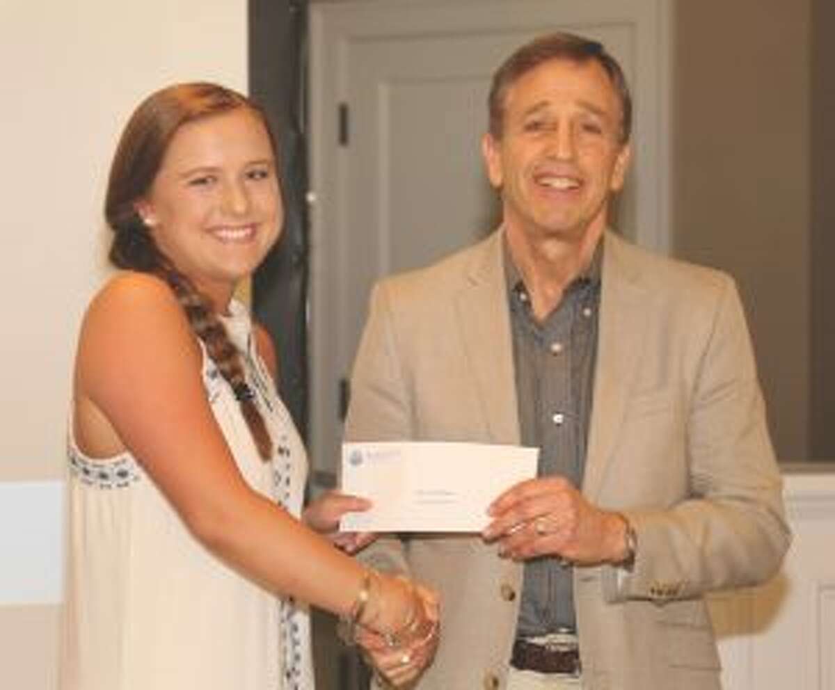 Grace McLean of Trumbull, a student at Trumbull High School, received a junior golf scholarship from Martin D. Schwartz, President and CEO of The Kennedy Center, during the Kennedy Center’s Charity Golf Classic at Shorehaven Golf Club in Norwalk. Alexa Brown and Taylor Brown, junior golfers from Trumbull High, also were awarded scholarships.
