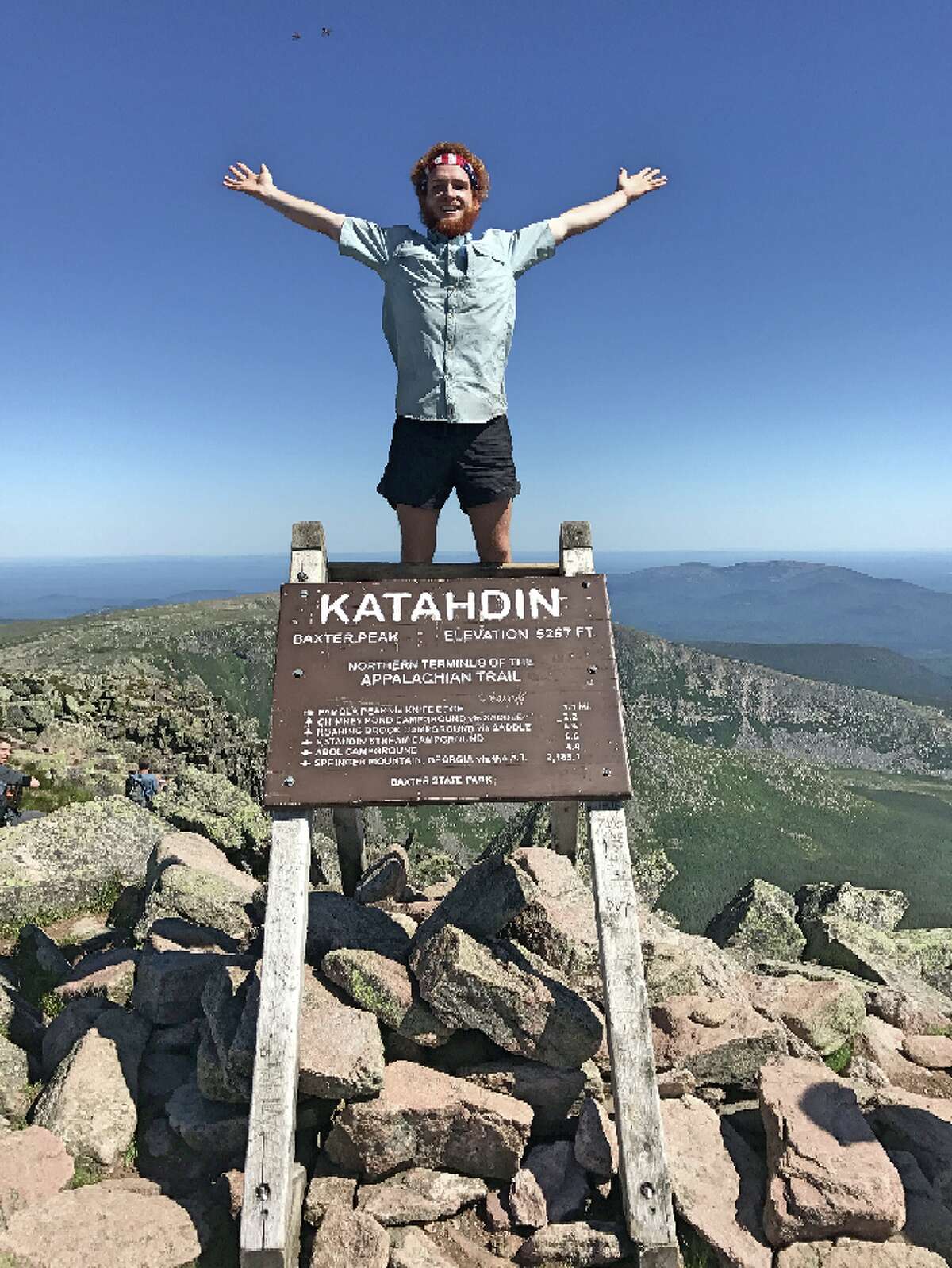 Billy McGovern stands atop Mount Katahdin after completing the Appalachian Trail, which runs from Georgia to Maine.