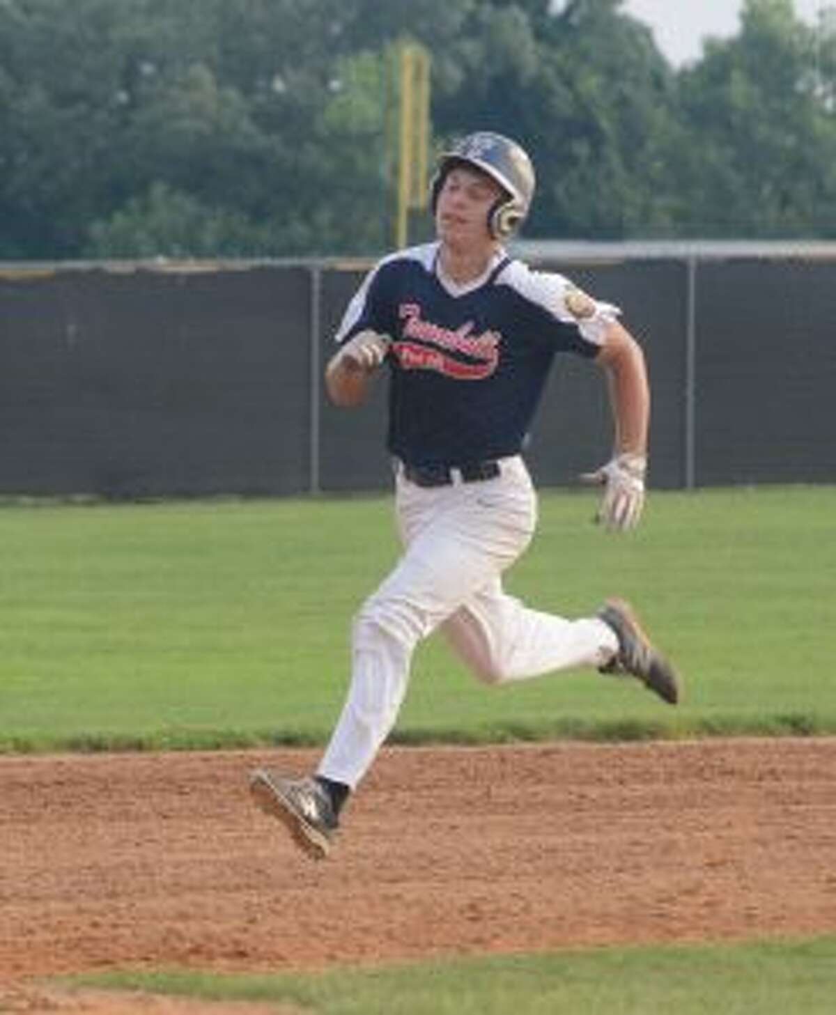 Dan Ruchalski steams into third after hitting a three-run triple. — Andy Hutchison photo
