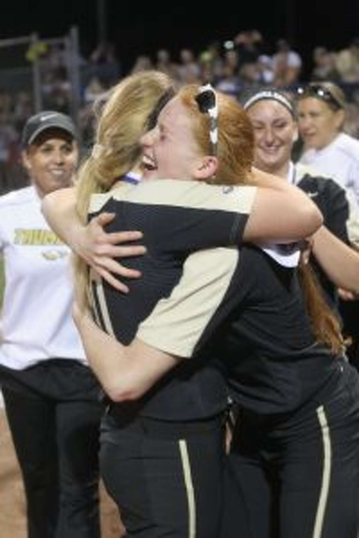 Taylor Brown hugs Ally Szabo following Trumbull’s win in the Class LL state championship game. — Bill Bloxsom photo