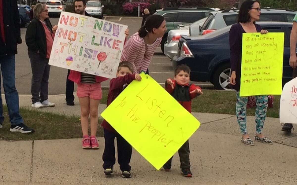 About 70 residents turned up an hour before the Town Council meeting to protest the community center and the proposed sale of six town-owned properties.