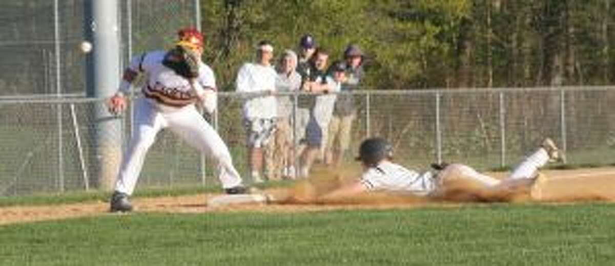 Sam Montalvo slides safely into third base as St. Joseph's Charlie Pagliarini waits for the throw. — Bill Bloxsom photo