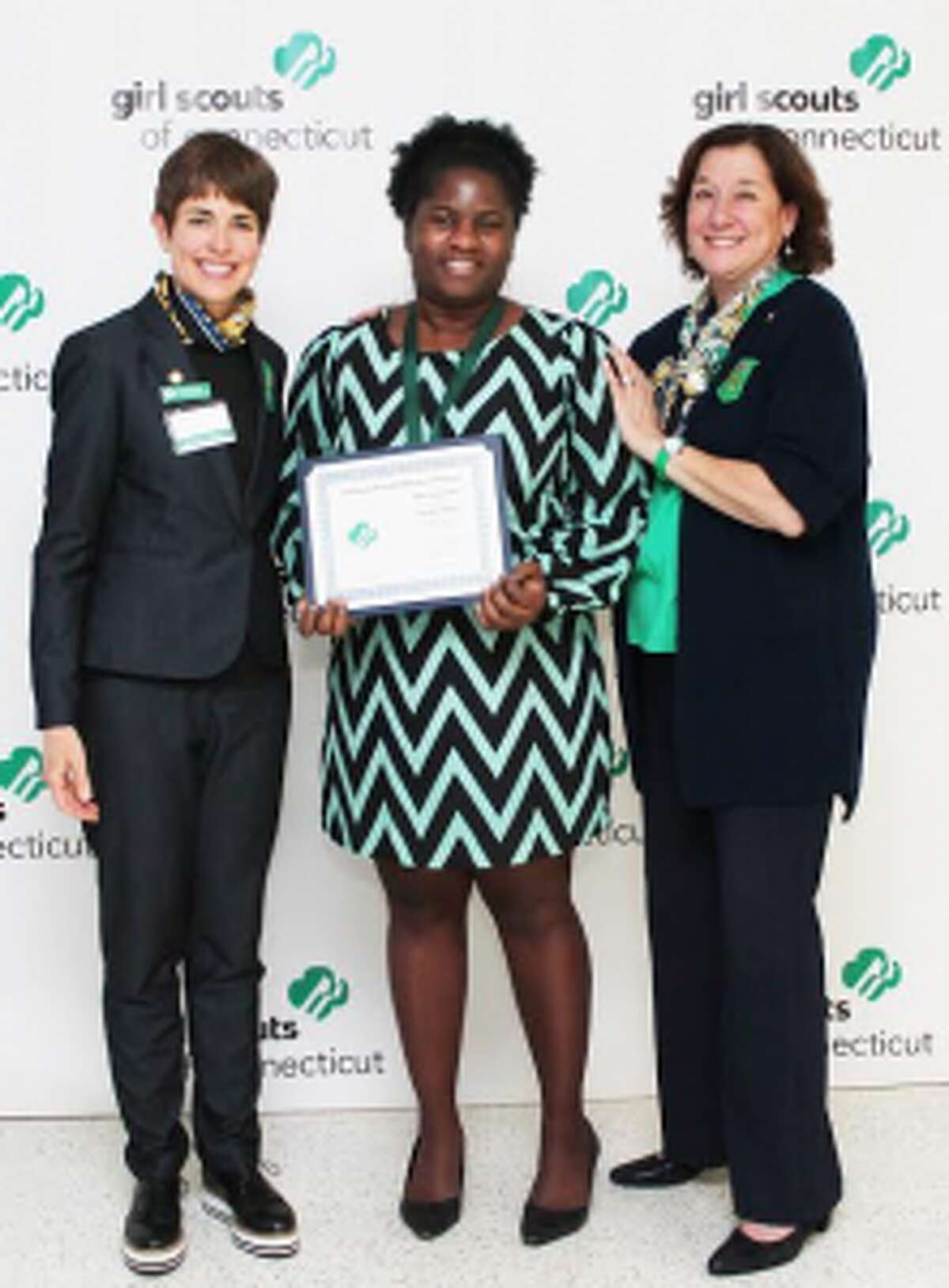 Trumbull resident Claudine Phaire, center, receives a national appreciation award from state President Trish Bowen and CEO Mary Barnaby. — Submitted