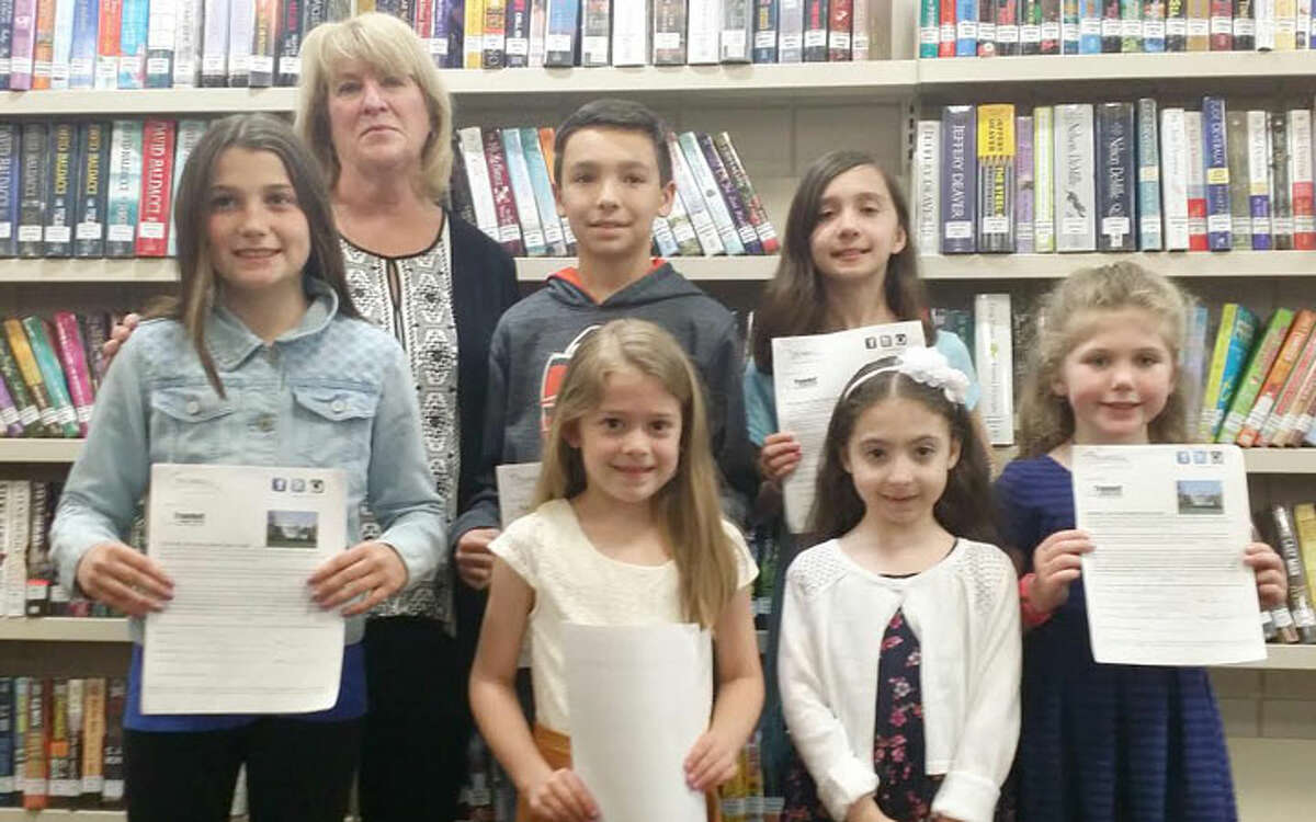 Essay contest winners pose with OBOT committee member Diane Strever: Ava Meagher, Bobby Welch, Abigail Horan, Sophia Pucci, Guliana Clericuzio, and Maura Brunt.