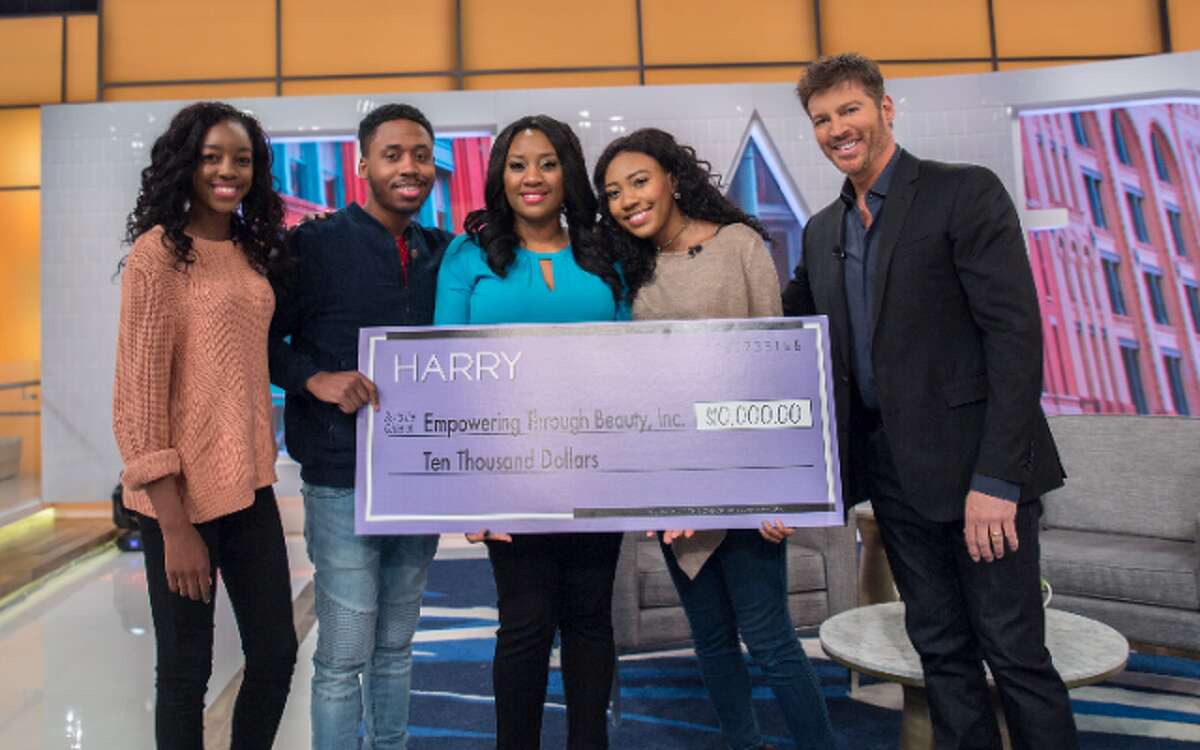 Tanisha Akinloye with her children on stage with Harry Connick Jr. — Submitted photo