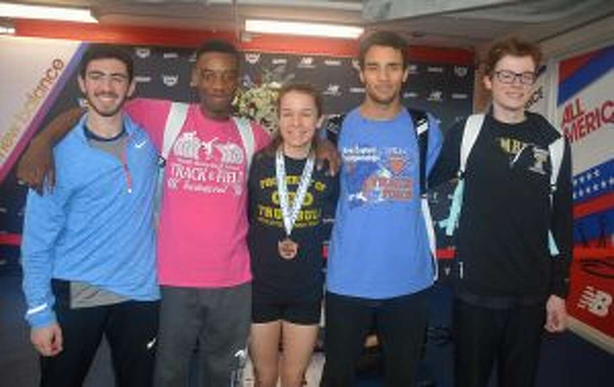 Tyler Rubush, Nigel Hayes, Kate Romanchick, Tyler Gleen and Colin McLevy celebrate after medaling at the New Balance Indoor Track Nationals.