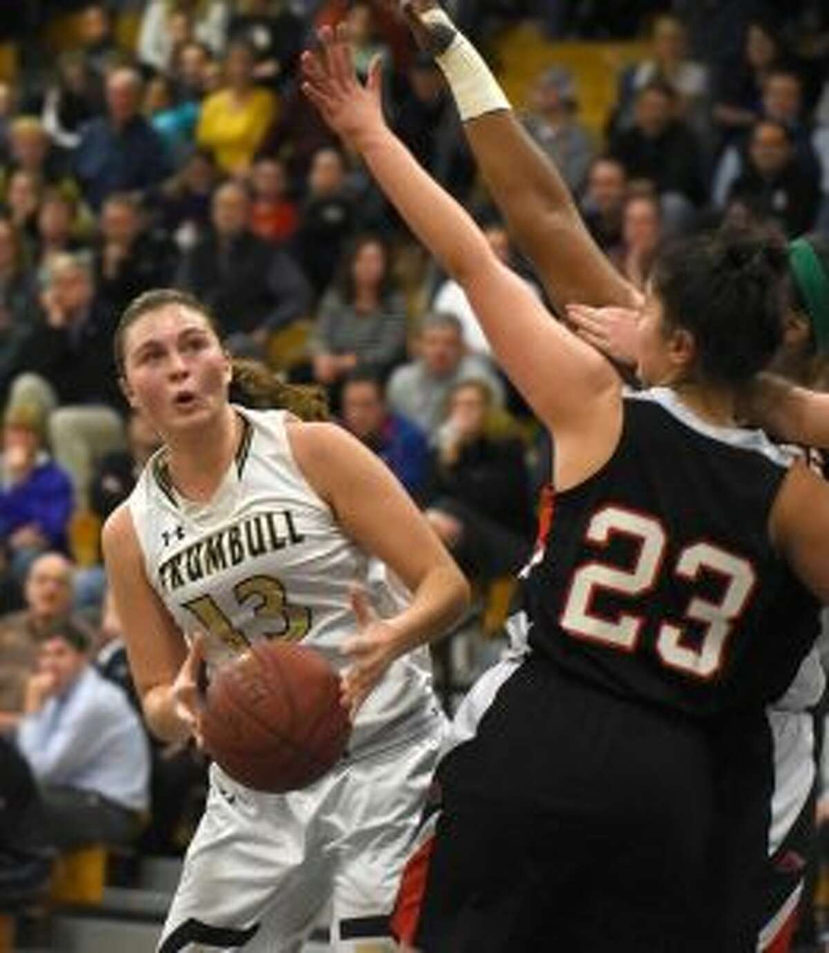 Claudia Tucci looks for room to shoot in Trumbull's overtime thriller with Warde. — Dave Stewart photo