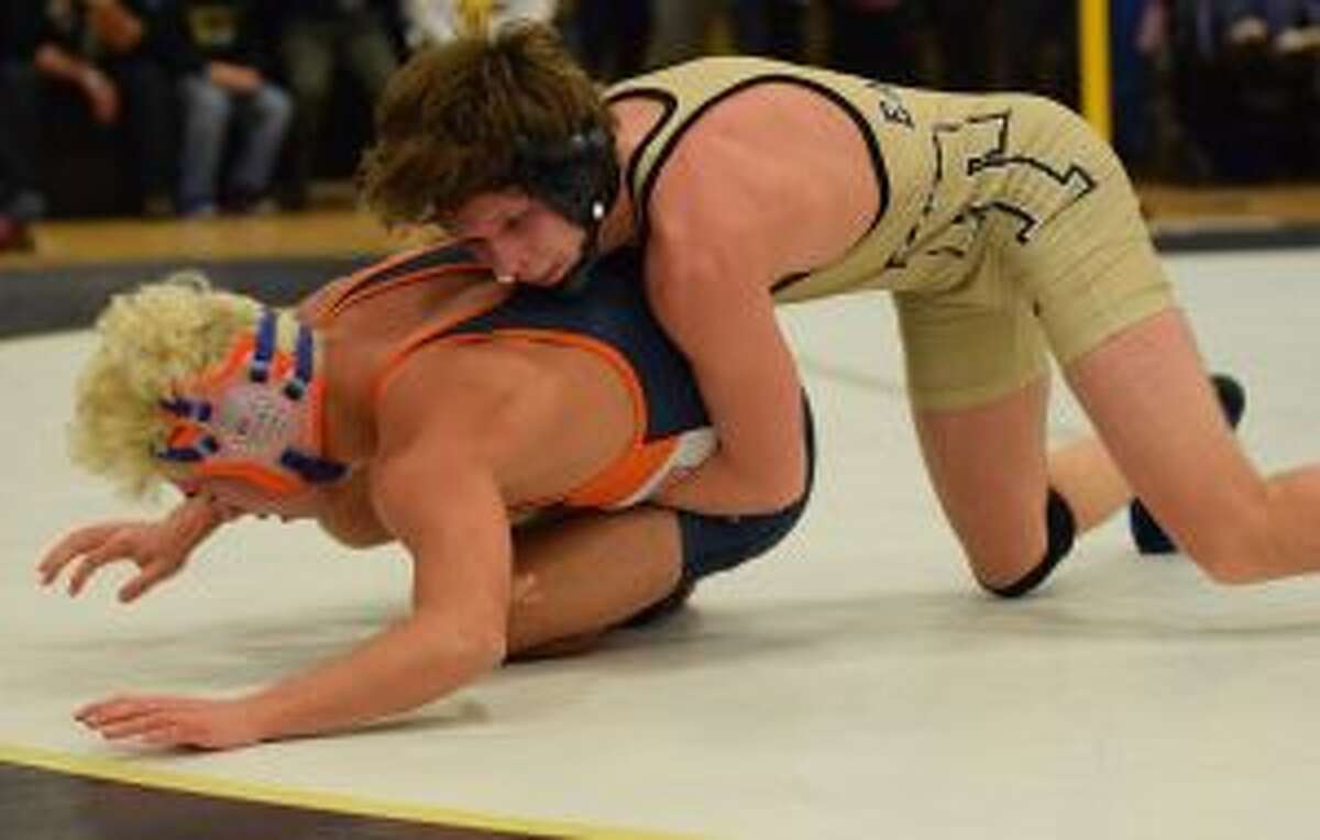 Trumbull's Tristan Haviland and Danbury's Kyle Fields wrestle in the state final. — Dee Sollenberger photo