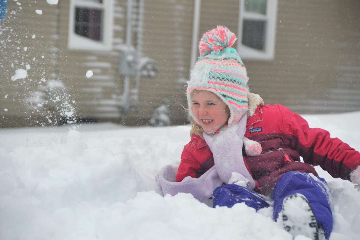 7 yr old Maura Brunt ducks as brother thows snowball at her