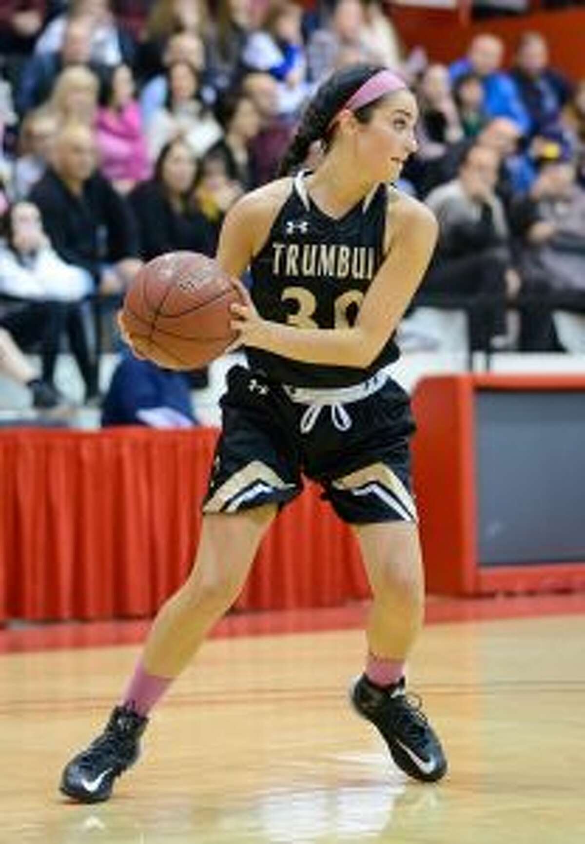 Trumbull's Victoria Ray looks up court.