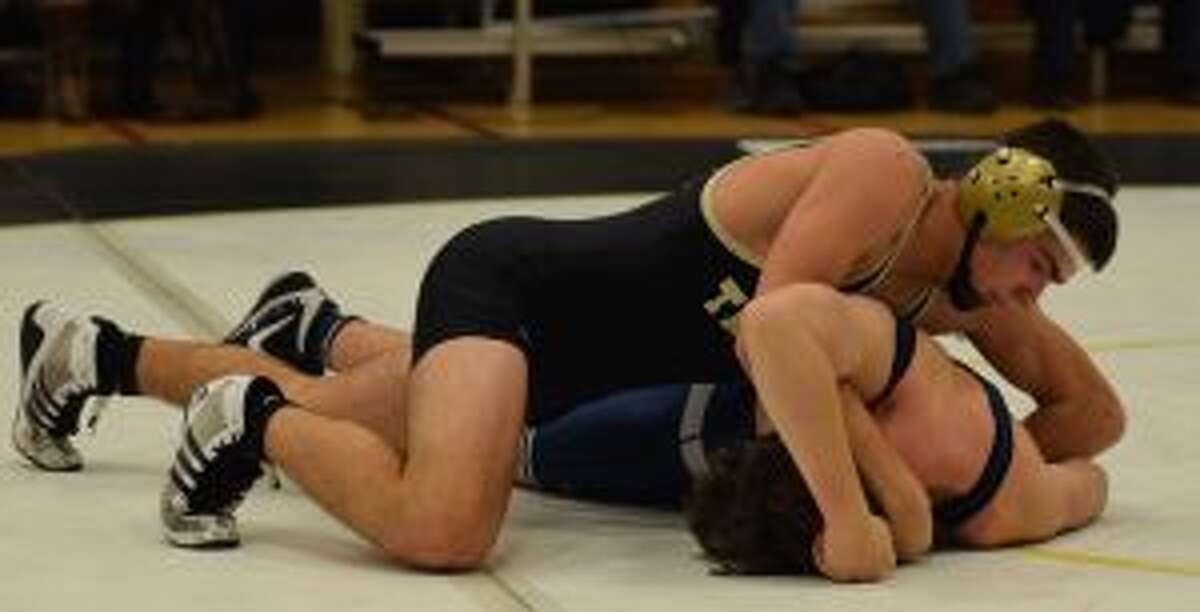 The Eagles' Brian Wallace pinned in 3:05 to win at 152 pounds. — Dee Sollenberger photo
