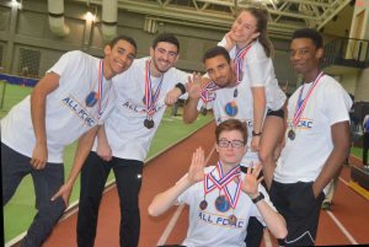 Trumbull High's Latrell Margraf, Tyler Rubish, Tyler Gleen, Colin McLevy (bottom), Kate Romanchick (top) and Nigel Hayes celebrate earning first team All-FCIAC honors.