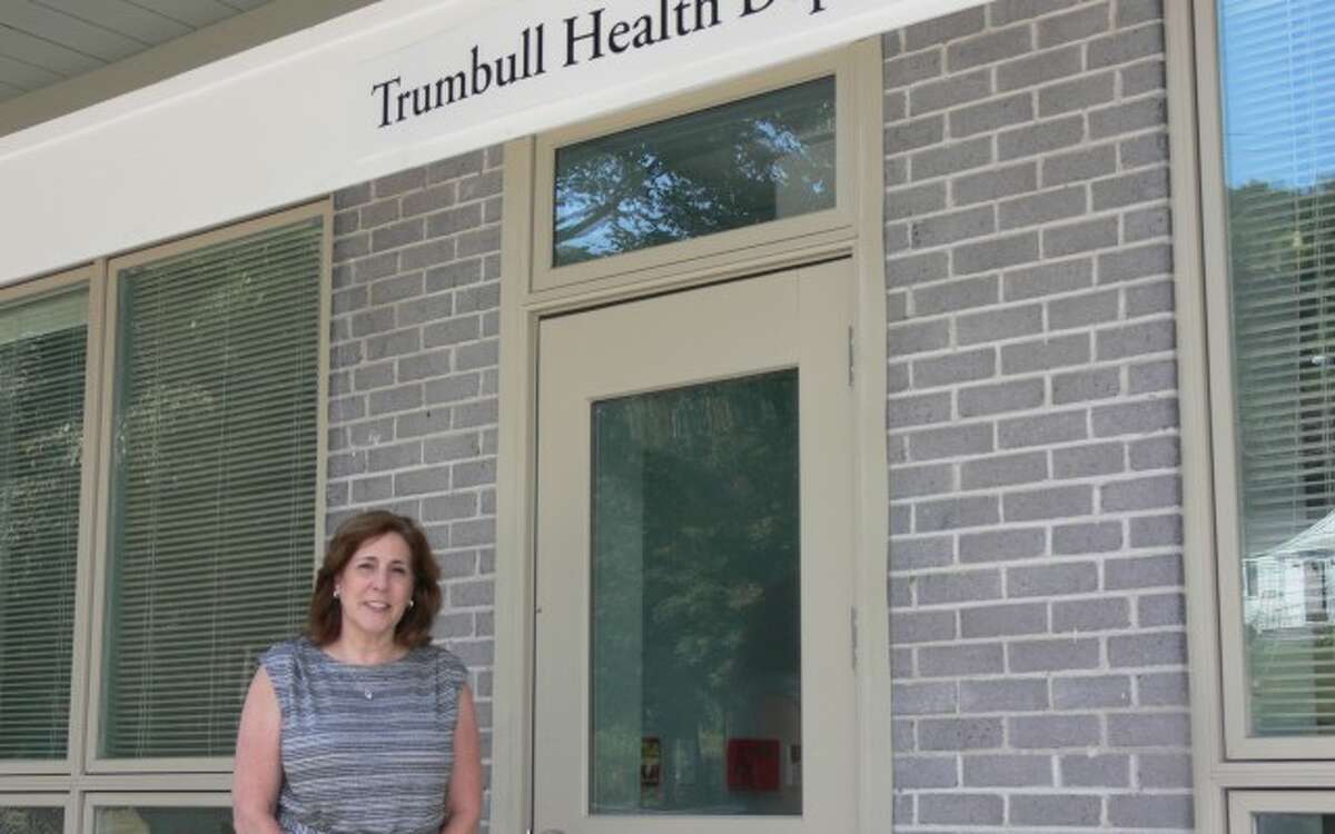 Rhonda Capuano, the director of the Trumbull Health Department, stands outside the town's new building on White Plains Road.