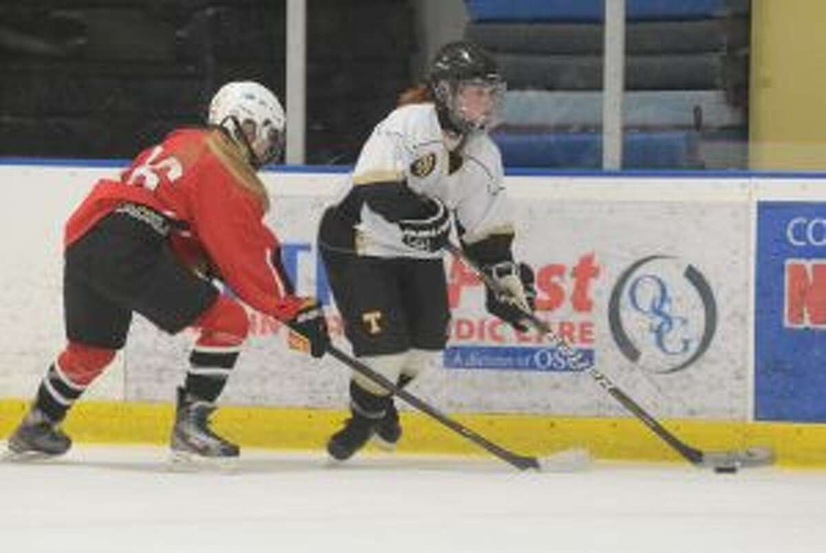 Erin Owens handles the puck. She had a goal and three assists. — Andy Hutchison photo