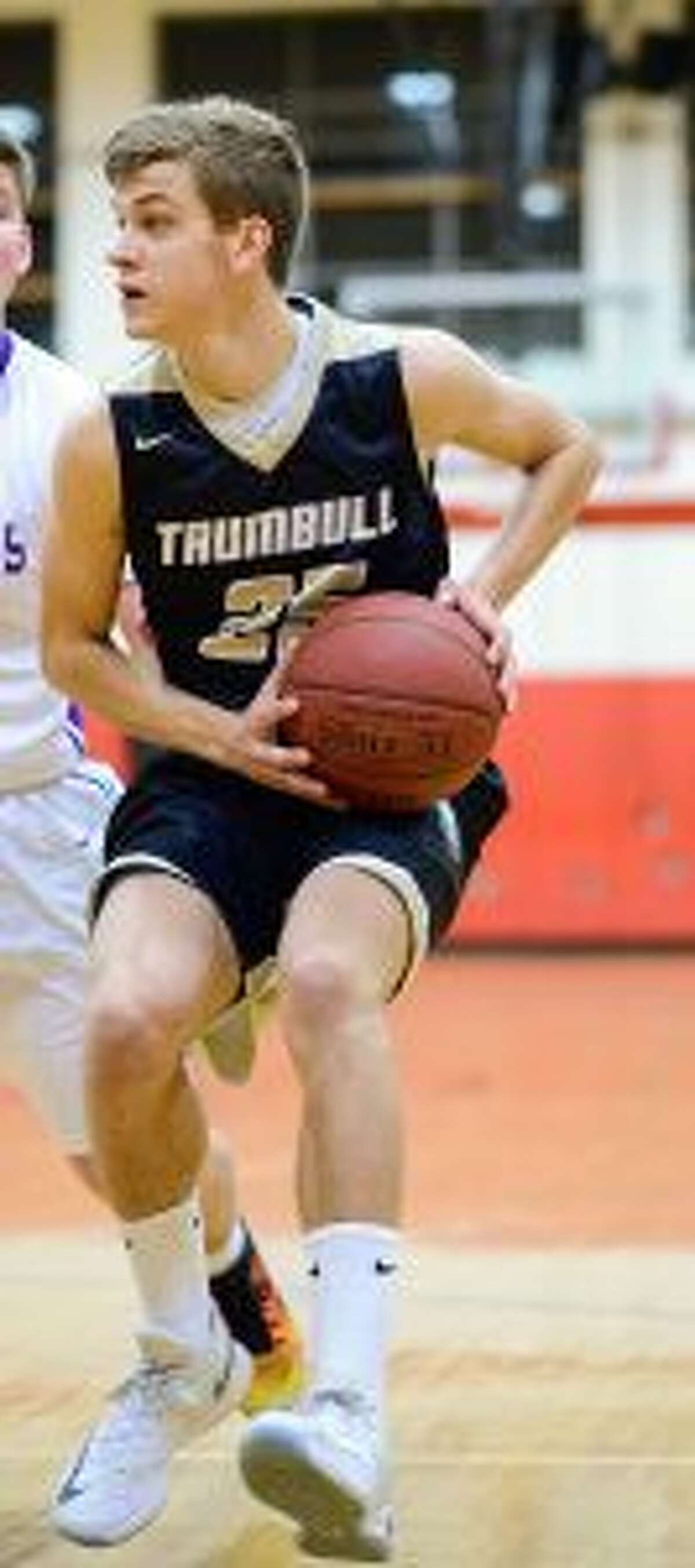 Trumbull High's J.J. Pfohl beat the buzzer with a basket to give his Eagles the win. - David G. Whitham photo