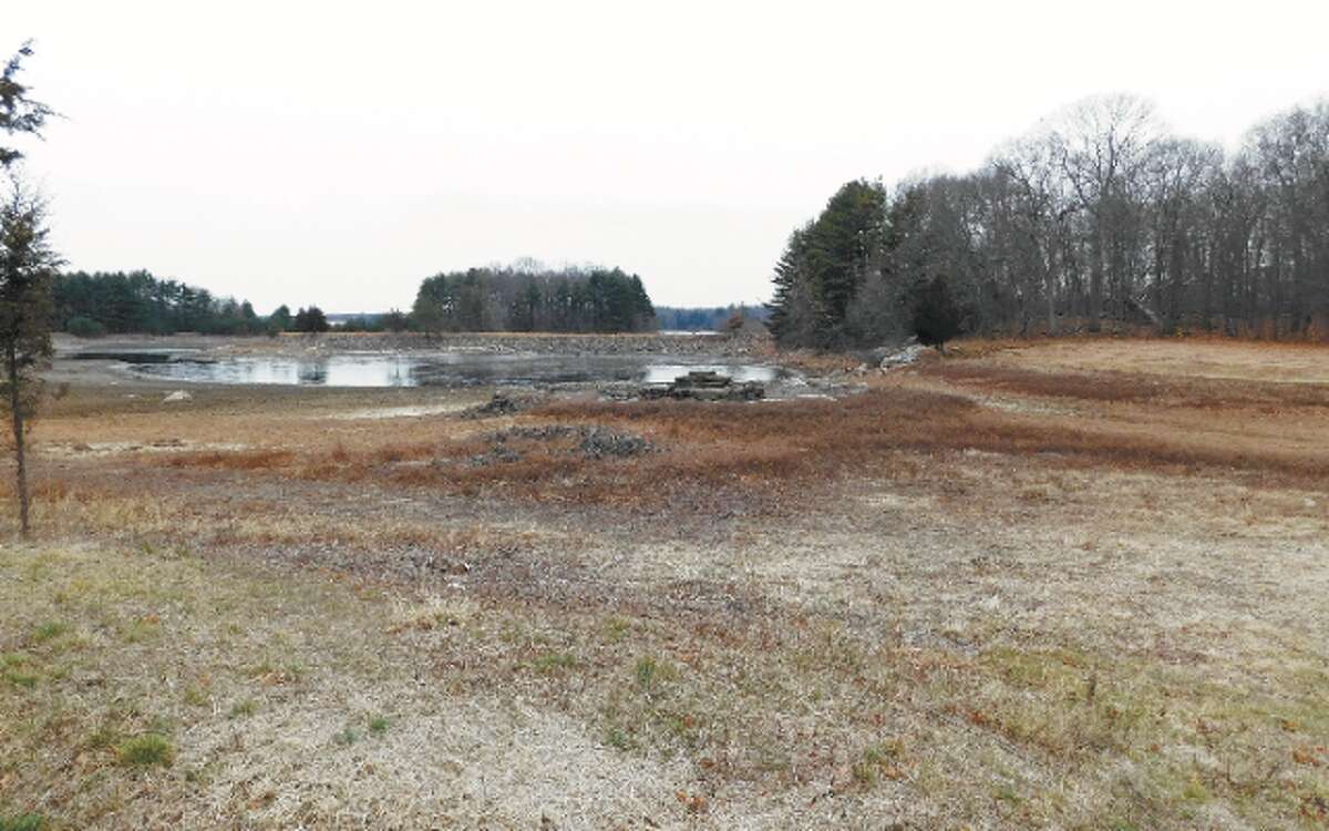 The ongoing drought has lowered reservoir levels in the Aquarion Water Co. system serving Fairfield County, including at Trap Falls Reservoir in Shelton, as shown here. — Brad Durrell photo