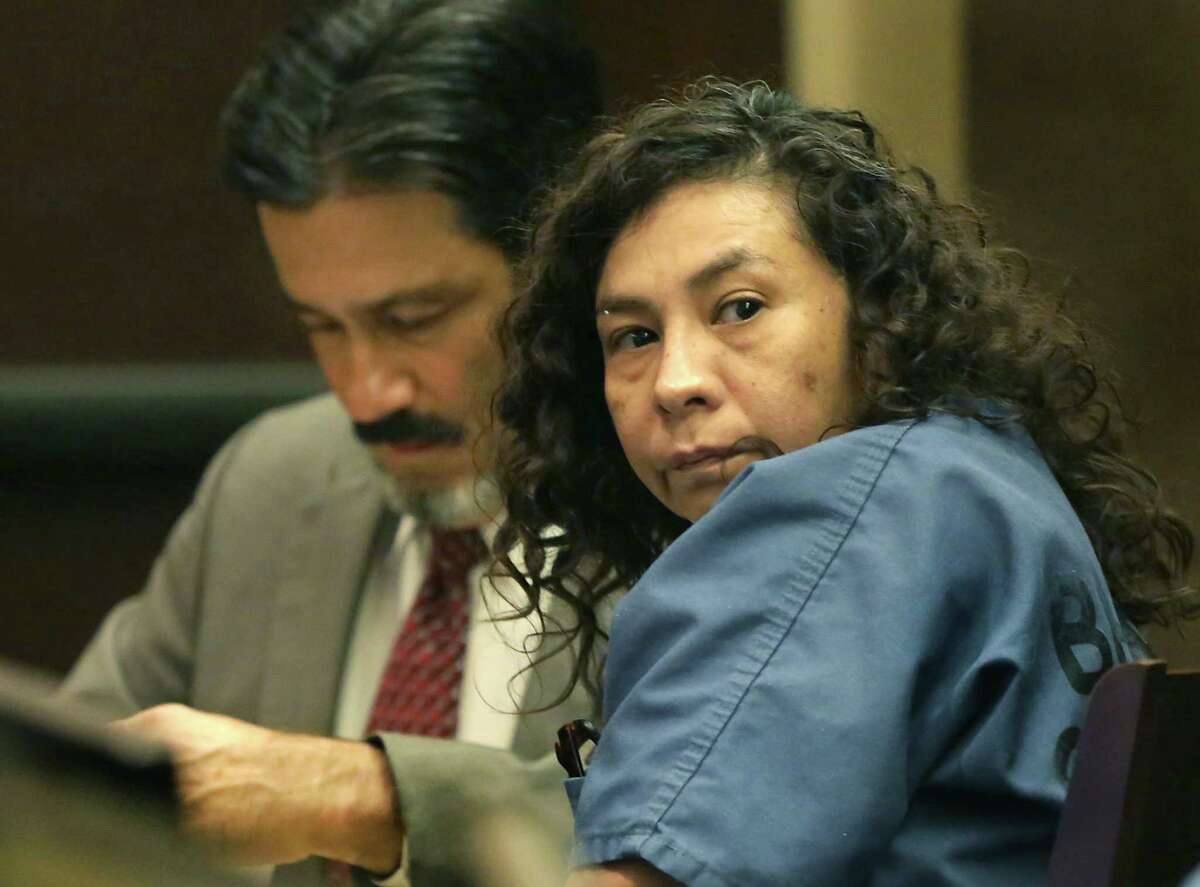 Angie Torres looks towards family members as she appears in the 227th District Court at the Cadena-Reeves Justice Center on Monday, June, 3, 2019. Torres staged the kidnapping of 8-month-old King Jay Davila with the boy's father, Chris Davila, who is Torres' cousin. At left is her lawyer Karl Basile.