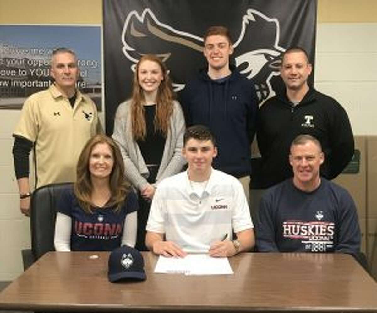 Trumbull High’s Chris Brown signed a letter of intent to play baseball at the University of Connecticut. Pictured with Chris are mom Nancy and dad Bill; (back row) THS assistant coach Buddy Bray, sister Taylor, brother Billy and THS head baseball coach Phil Pacelli.