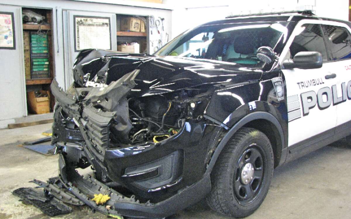 The police K9 vehicle damaged in the arrest is awaiting repairs at a Bridgeport body shop. - Donald Eng photo