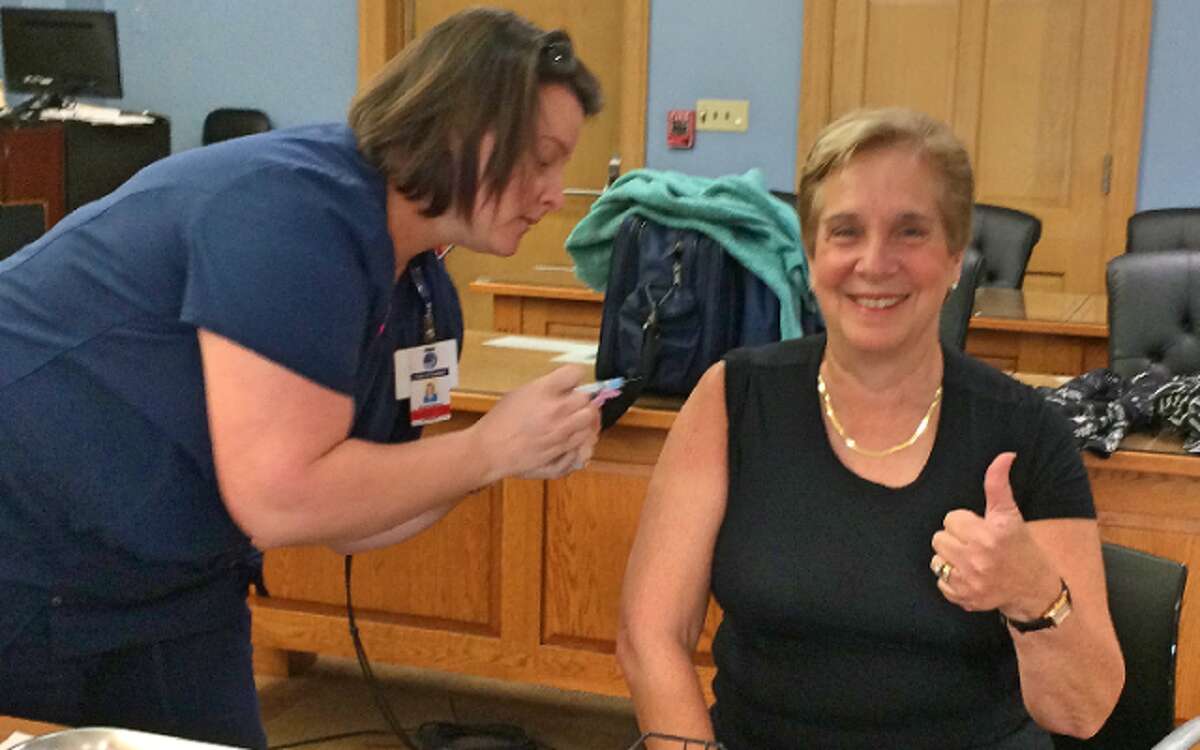 First Selectman Vicki Tesoro is all smiles after receiving her flu shot Tuesday. — Donald Eng photo