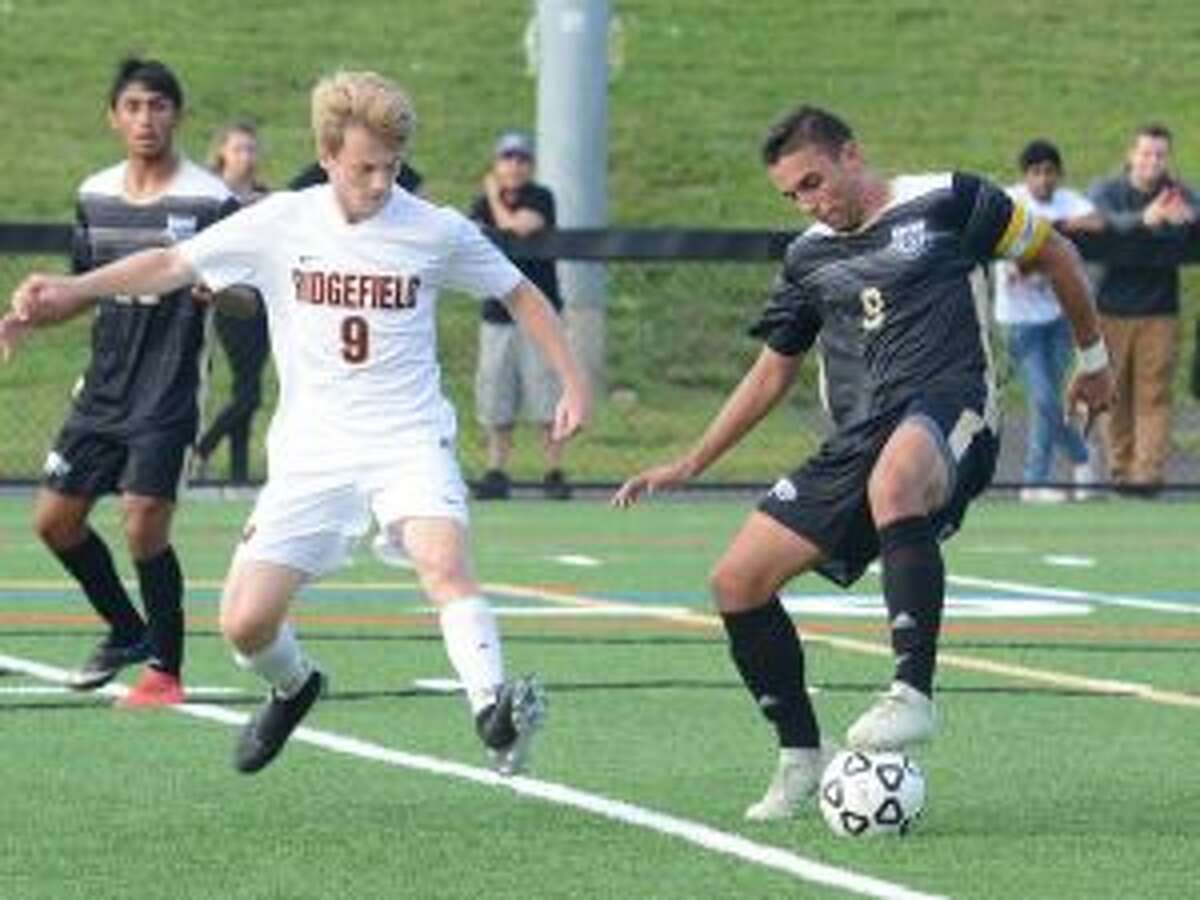 Jason Weinstein scored five goals and had an assist when Trumbull defeated Ridgefield, 6-2. - Andy Hutchison photo