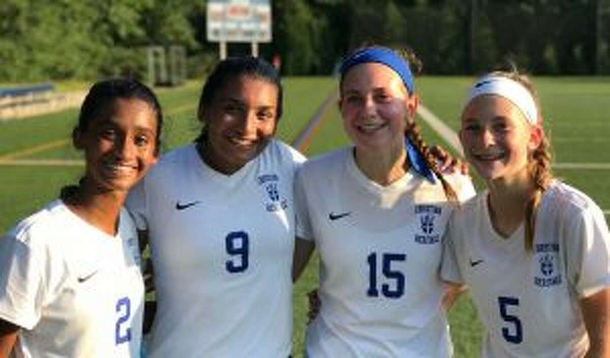 Natania Muriel, Ranita Muriel, Mia Angelini and Alex Angelini put up points in the win over King School.