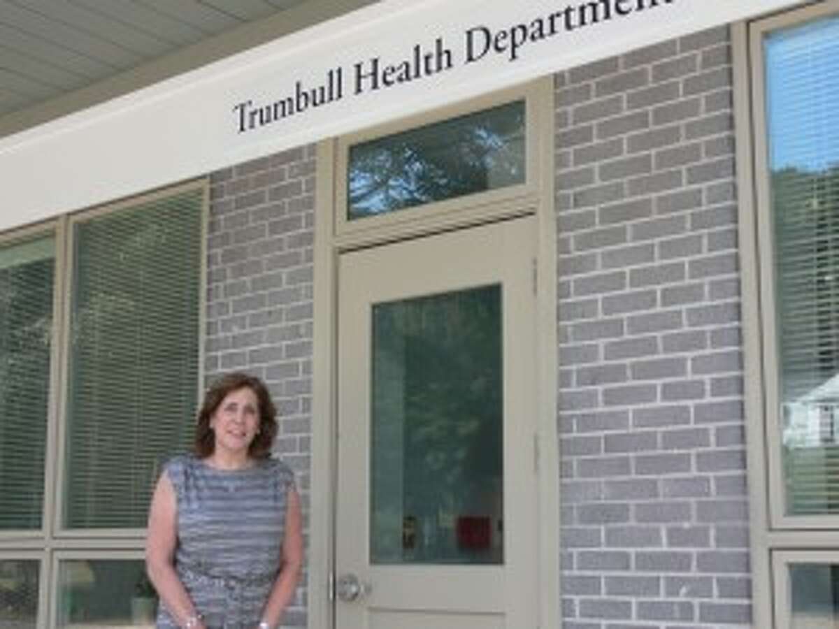Rhonda Capuano, the director of the Trumbull Health Department, stands outside the town's new building on White Plains Road.