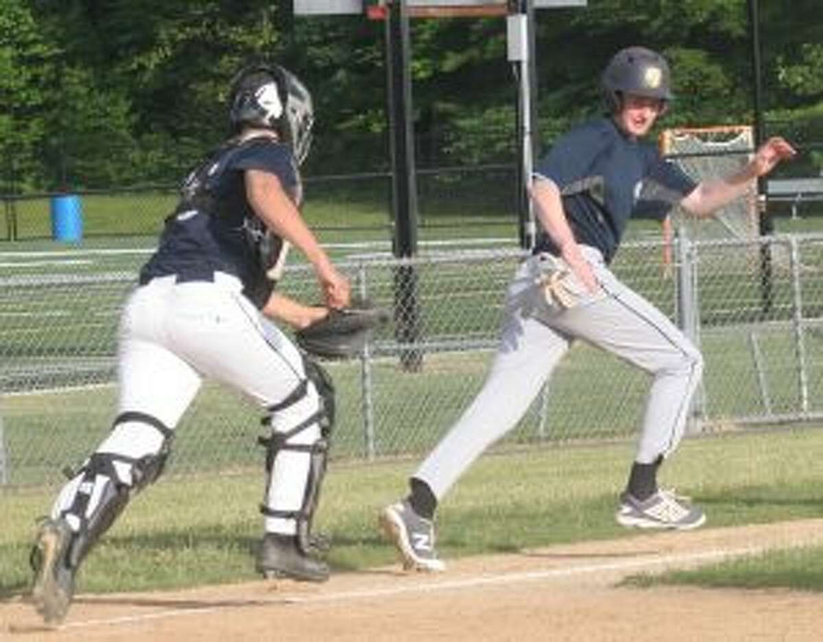 Andrew Weinbrum is caught in a run down by Trumbull catcher Rob Goldsmith.